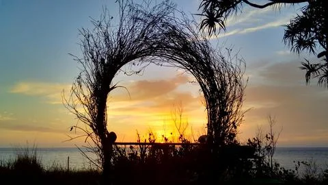 View of the sunset with the orange clouds and blue sky Stock Photos