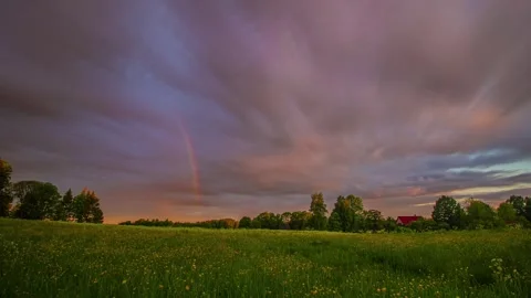 View of sunset over a green meadow in Latvia. 스톡 동영상 341455102