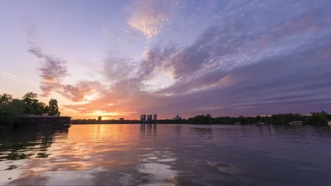 View of sunset over Herastrau Lake with city skyline, Romania. Stock Footage 335600528
