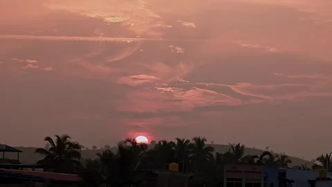 View of sunset over urban area with buildings silhouetted against warm glow.. Stock Footage 336042881