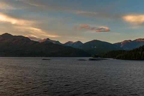 The view at sunset from the side of a ferry as it makes its way through the I Stock Photos
