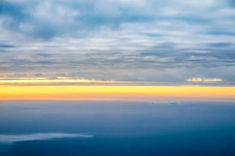 View sunset with sky and cloudy from airplane window when flying,Nature backg Stock Photos