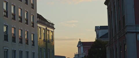 View of a sunset sky between buildings Stock Footage 151395495