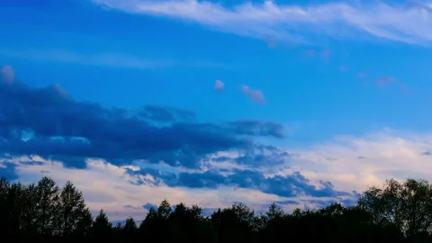 View of the sunset sky with clouds and the treetops in the forest. 4k resolution Stock Footage 155941734