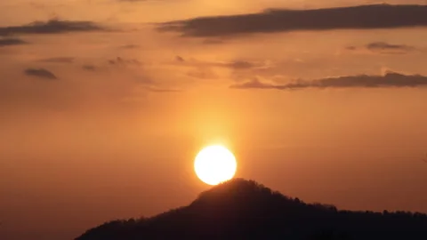 View of Sunset sun and clouds above mountains. Stock Footage 142124528