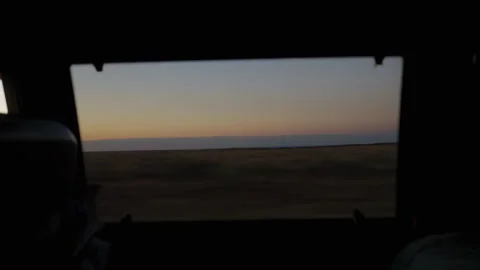 A view at sunset through a van window, driving through the western United Stock Footage 331229219
