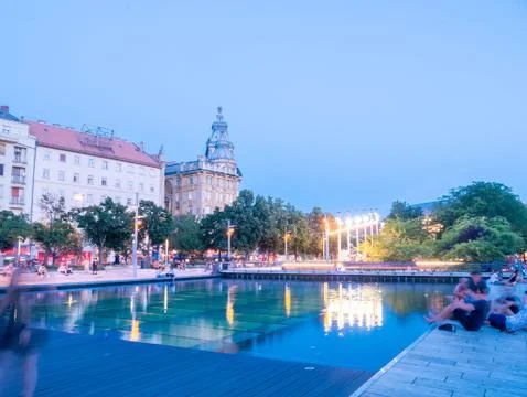 View on the sunset while the people resting on the Francis square in Budapest Stock Photos