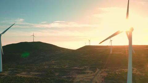 View sunset of wind turbines in wind farm generating green energy. Beautiful Video stock 197531791