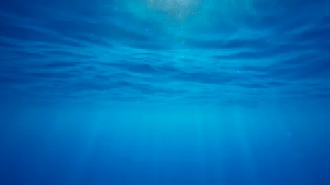 View of sunshine with ripples under blue water surface on daytime, slow motion Stock Footage 252827208