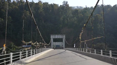 View of a suspension bridge with prayer flags in Surkhet, Nepal. Stock Footage 335468322