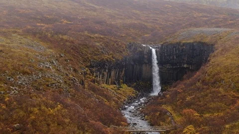 View of Svartifoss basalt waterfall handheld 1080 Stock Footage 100765680