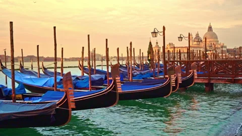View of swaying gondolas, lanterns standing in the azure water of the lagoon Stock Footage 261987806
