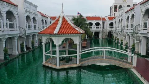 View of swimming pool inside the hotel. Green color of swimming pool at the.. Stock Photos