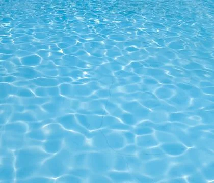 View of a swimming pool with reflections background. Stock Photos