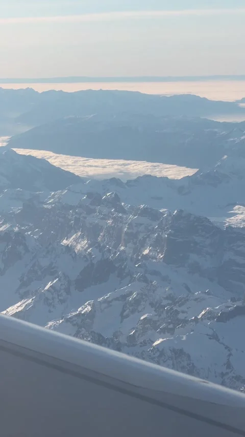 View of the Swiss Alps from the window of a plane Stock-Footage 303956908