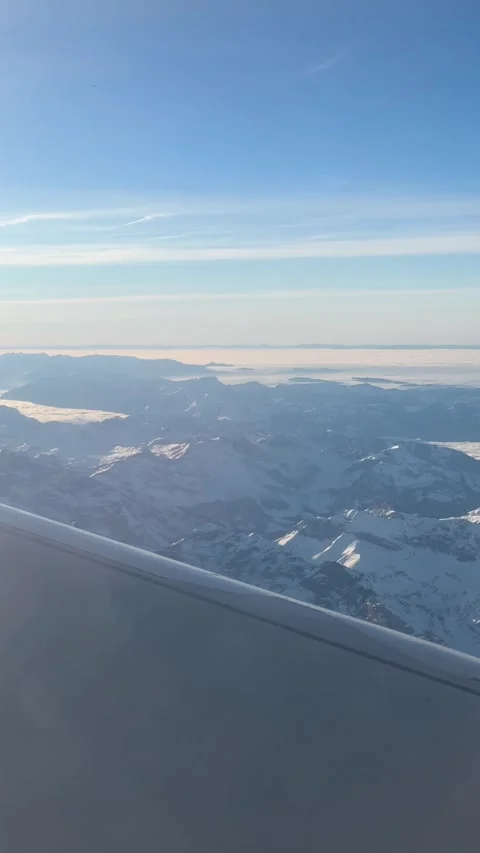 View of the Swiss Alps from the window of a plane 스톡 동영상 303956969
