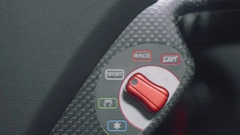 View of switch controlling mode of suspension, transmission and engine in sport Stock Footage 96521303