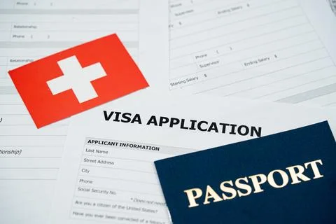 View of Switzerland visa application form with passport and national flag Stockfoto's