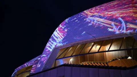 View of Sydney Opera House sails and side window from low angle lit up Stock Footage 128401645