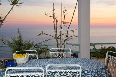 The view from a table on a balcony during sunset Stock Photos