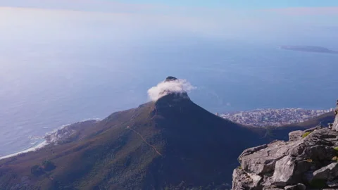 View from Table Mountain of Lions's Head with a cloud covered peek Stock Footage 242012961