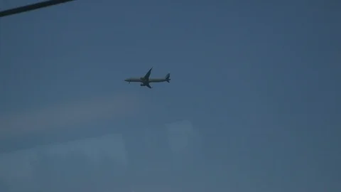 View of the takeoff of the aircraft from the window of a moving train. The view Stock Footage 105873700