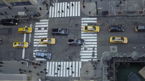 View from tall building downward angle in Midtown Manhattan busy intersection Stock Footage 60937725