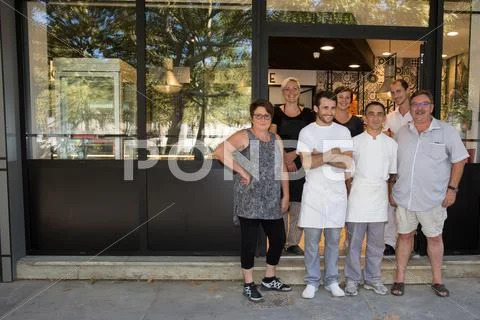 View of a Team of bakers working at the bakery Stock Photos