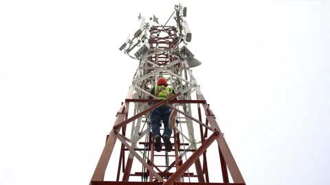 View of a technician climbing a telecommunications tower, Bangladesh. Stock Footage 335561593