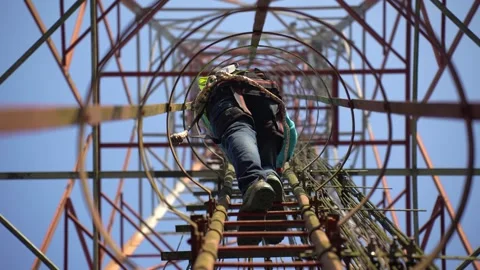 View of a technician climbing a telecommunications tower, Bangladesh. Stock Footage 335561672