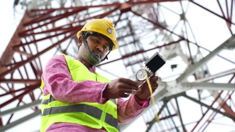 View of a technician working at a telecommunications tower, Bangladesh. Stock Footage 335561694