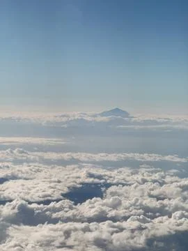 View of the Teide volcano from the airplane window. Flight to Tenerife and .. Stock Photos