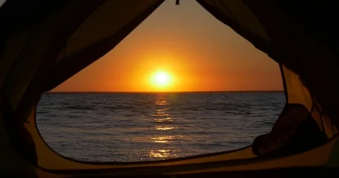 View from the tent at sunset by the sea Stock Footage 83575228