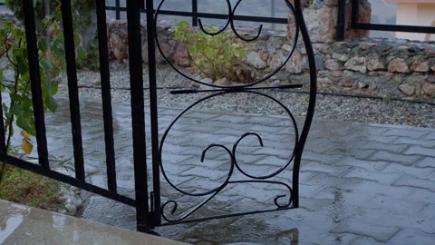 View from the terrace onto the path, wrought iron gate Stock Footage 316068231