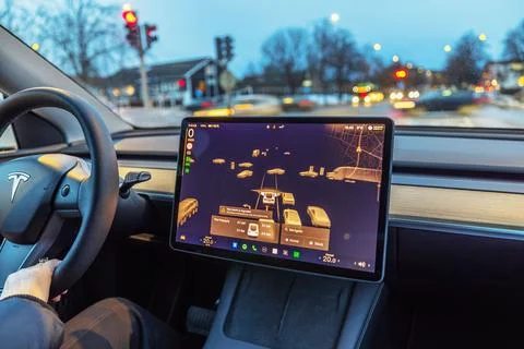 View of Tesla Model 3 interior with autopilot visualization on touchscreen 写真素材