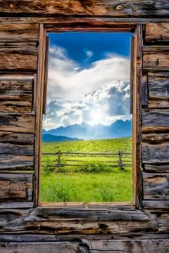 View of the Tetons Through a Cabin Window Stock Photos