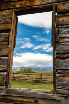 View of the Tetons Through a Cabin Window Stock Photos