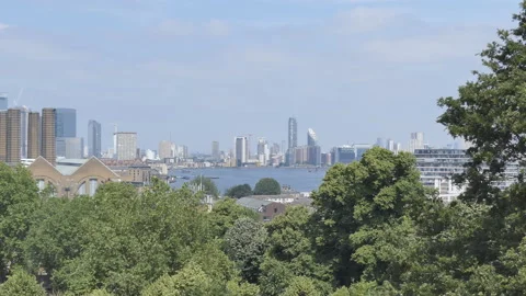 A view of the Thames River and cityscape from a park. Stock Footage 129241926