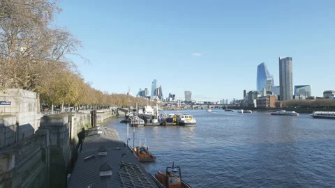 A view of the Thames River and London riverside on a sunny day. Stock Footage 167654638