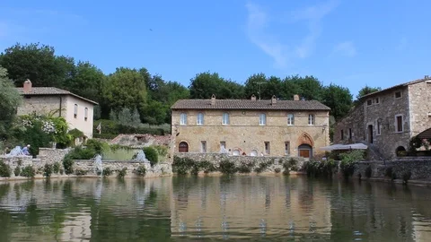 View of the thermal bath in the square of Bagno Vignoni, Siena, Tuscany, Italy Stock Footage 99154600