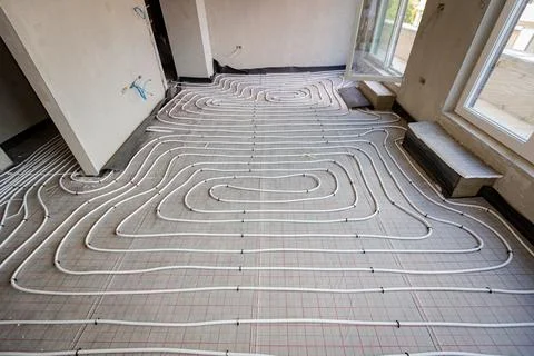 View on thin white tubes bended in complex curve of new brass, distribution.. Stock Photos