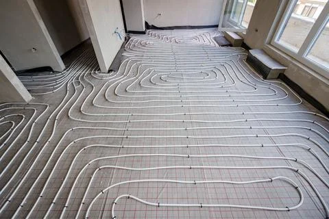 View on thin white tubes bended in complex curve of new brass, distribution.. Stock Photos