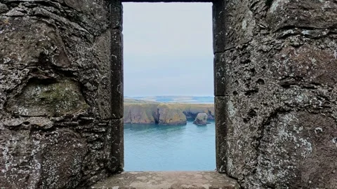 View though a Ruined Window at Dunnottar Castle on a Dull Autumn Day Stock Footage 329000032