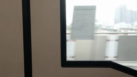 View though skytrain window while train is running with view of bangkok cit.. Stock Footage 279444183