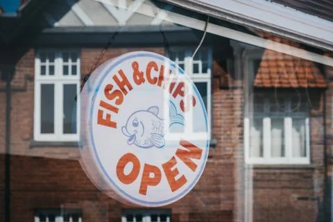 View though the window of an open sign in a fish and chips shop in Sheringham Stock Photos