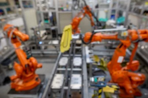 View to three automatic robots arm machine in automotive industrial, smart 库存照片