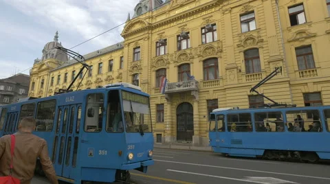 View of three blue trams driving on a street in Zagreb, Croatia Stock Footage 60805242