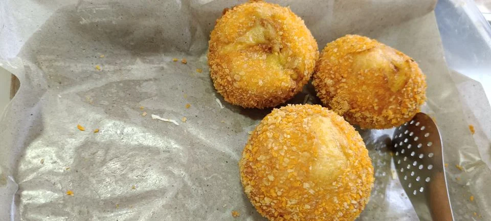 View of three fried meat-filled buns Stock Photos