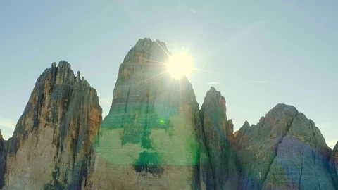View of the Three Peaks  of Lavaredo Mountains sun go behind Stock Footage 128951828