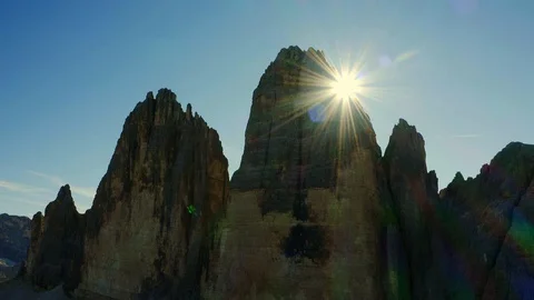 View of the Three Peaks  of Lavaredo Mountains and rainbow sun rays Stock Footage 128951873